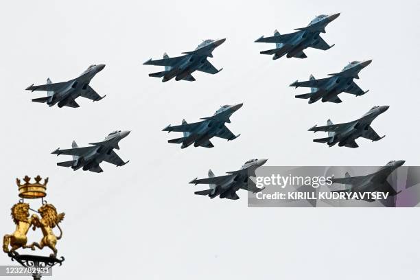 Russian Sukhoi Su-35S fighter aircrafts, Su-34 military fighter jets and Su-30SM jet fighters fly in formation over central Moscow during the Victory...