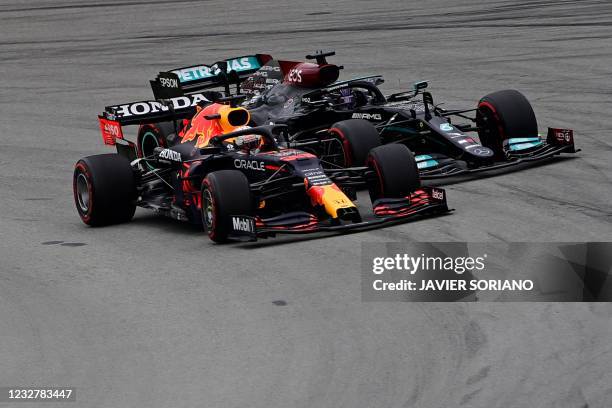 Red Bull's Dutch driver Max Verstappen overtakes Mercedes' British driver Lewis Hamilton at the start of the Spanish Formula One Grand Prix race at...