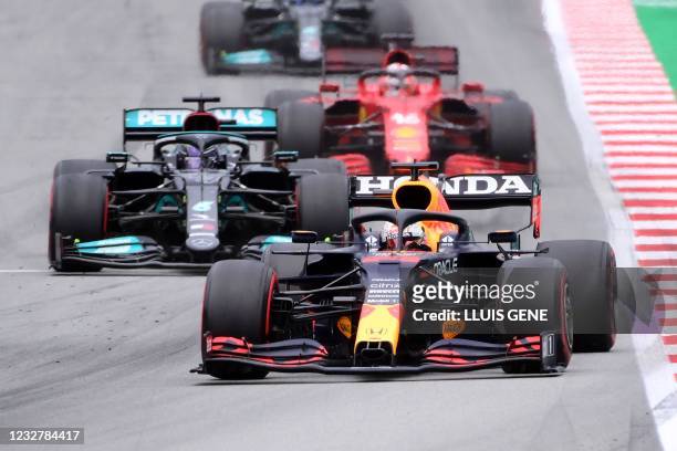 Red Bull's Dutch driver Max Verstappen drives ahead of Mercedes' British driver Lewis Hamilton and Ferrari's Monegasque driver Charles Leclerc during...