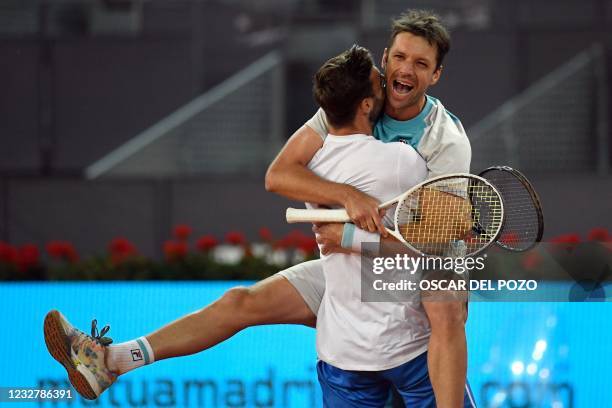 Spain's Marcel Granollers and Argentina's Horacio Zeballos celebrate beating Croatia's Mate Pavic and Nikola Mektic during their 2021 ATP Tour Madrid...