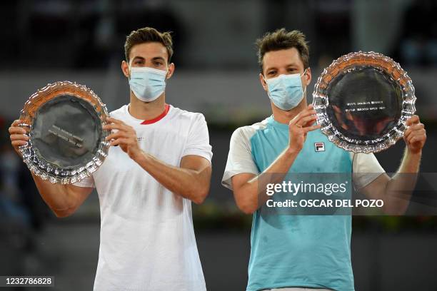 Spain's Marcel Granollers and Argentina's Horacio Zeballos celebrate with thier trophies after beating Croatia's Mate Pavic and Nikola Mektic during...