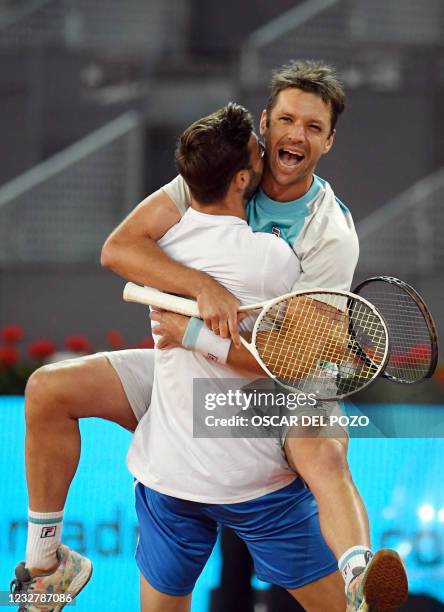 Spain's Marcel Granollers and Argentina's Horacio Zeballos celebrate beating Croatia's Mate Pavic and Nikola Mektic during their 2021 ATP Tour Madrid...