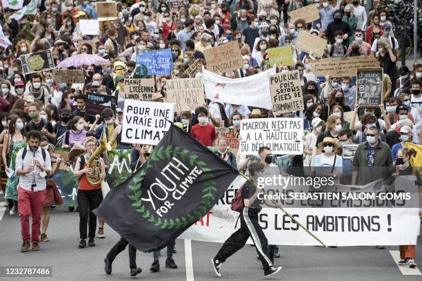 Demonstrator holds a flag reading "Youth for climate" during a "march for climate" called by youth for climate and several NGOs and unions as part of...