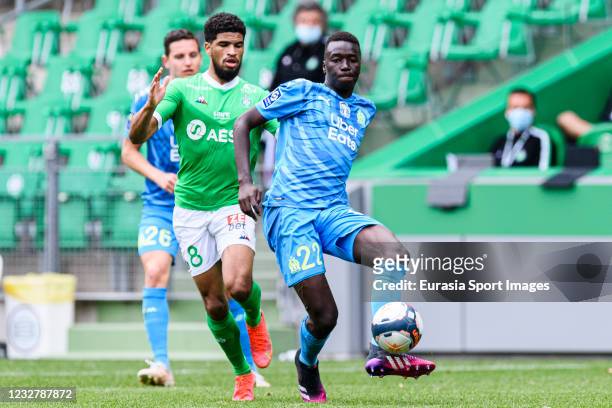 Pape Gueye of Olympique de Marseille passes the ball during the Ligue 1 match between AS Saint-Etienne and Olympique Marseille at Stade...
