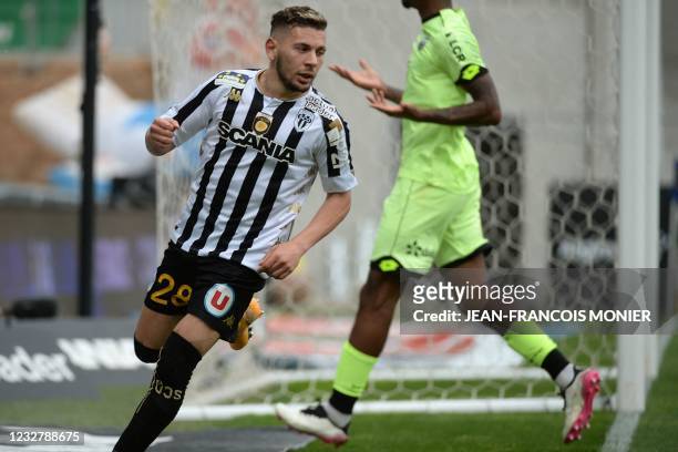 Angers' Algerian forward Farid El Melali reacts after scoring during the French L1 football match between Angers SCO and Dijon Football Cote-D'Or at...