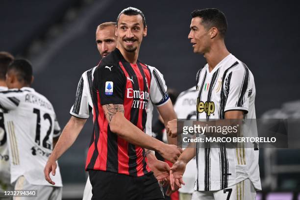 Milan's Swedish forward Zlatan Ibrahimovic and Juventus' Portuguese forward Cristiano Ronaldo react during the Italian Serie A football match...