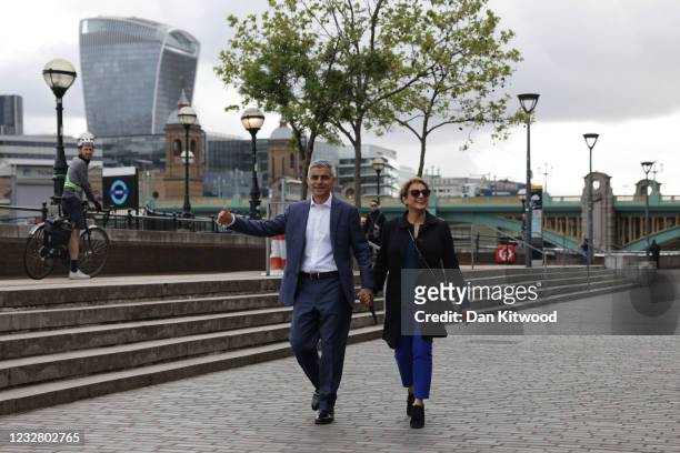 Mayor of London Sadiq Khan walks by the river Thames near Shakespeare's Globe with his wife Saadiya Khan on May 10, 2021 in London, England. Mr Khan...
