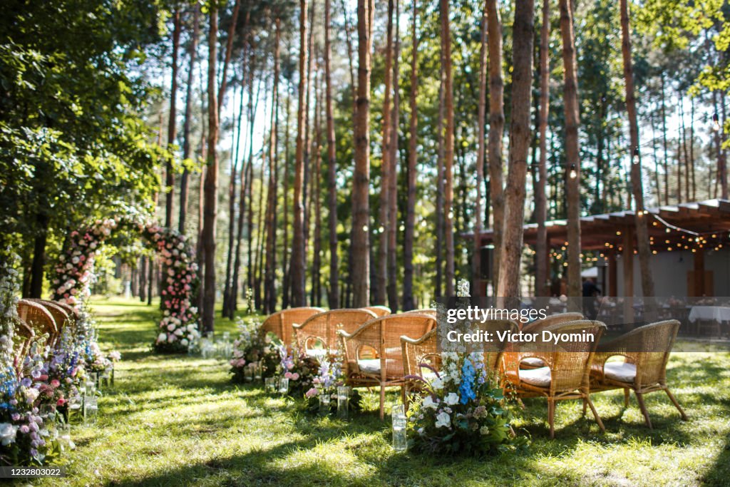 Wedding ceremony decorations in the green forest