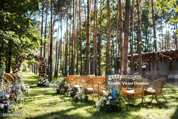 wedding ceremony decorations in the green forest - wedding ceremony seating stock pictures, royalty-free photos & images