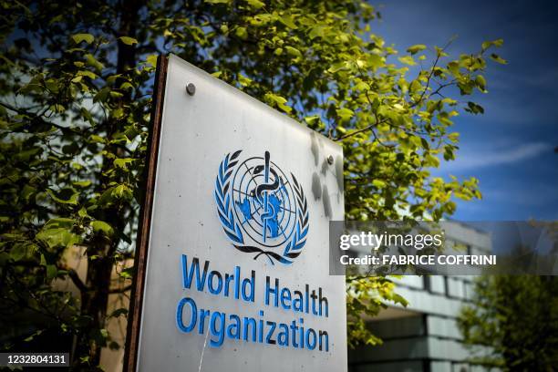 Picture taken on May 8, 2021 shows a sign of the World Health Organization at the entrance of their headquarters in Geneva amid the Covid-19...