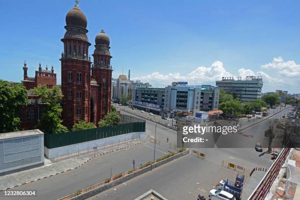 Deserted view of a road junction next to the Madras High Court building is pictured during a lockdown imposed by the state government as a preventive...