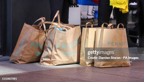 Primark bags in Dublin City centre following the phased reopening of non-essential retail, with click-and-collect services and in-store shopping by...