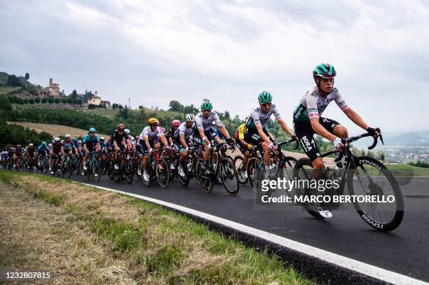 The pack rides near Guarene during the third stage of the Giro d'Italia 2021 cycling race, 190 km between Biella and Canale, Piedmont, on May 10,...