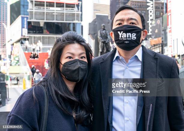 Mayoral candidate Andrew Yang with wife Evelyn Yang holds a press conference to address gun violence and recent shootings on Times Square. Andrew...