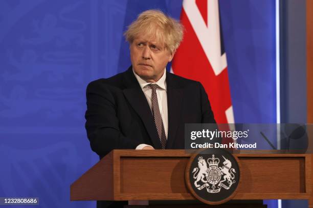 Britain’s Prime Minister Boris Johnson attends a virtual press conference to announce changes to lockdown rules in England at Downing Street on May...