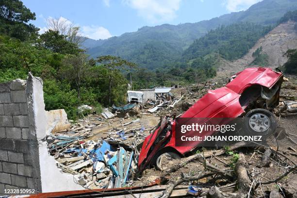 This photo taken on May 1 shows a view of a destroyed car in the Guatemalan village of Queja, San Cristobal Verapaz municipality, Alta Verapaz...