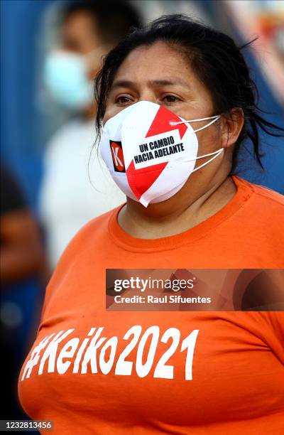 Supporter of presidential candidate of Fuerza Popular party Keiko Fujimori awaits for her arrival at Asentamiento Pomacocha-Manolo Castillo in Villa...