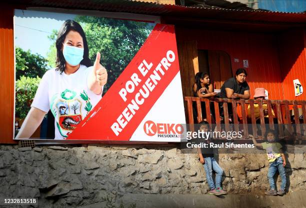 Supporters of presidential candidate of Fuerza Popular party Keiko Fujimori await for her arrival at Asentamiento Pomacocha-Manolo Castillo in Villa...