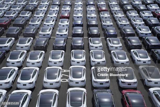 Tesla Inc. Vehicles in a parking lot after arriving at a port in Yokohama, Japan, on Monday, May 10, 2021. Tesla sold a record of almost 185,000...