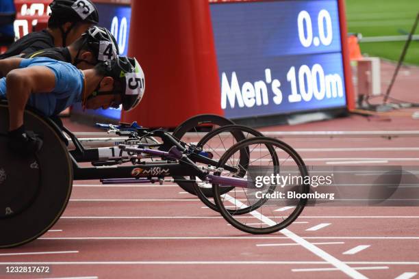 Athletes position at the start line during a para athletics test event for the Tokyo 2020 Paralympic Games at the National Stadium in Tokyo, Japan,...