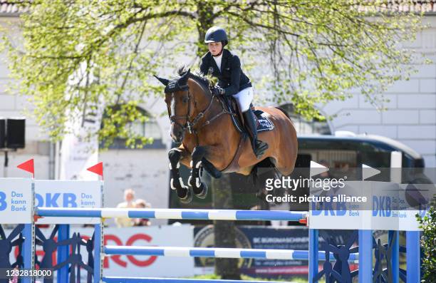 May 2021, Mecklenburg-Western Pomerania, Redefin: Riders Tour, Grand Prix, Jumping competition at the State Stud Redefin. Sophie Hinners from Germany...