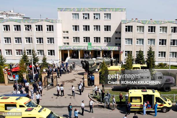 Law enforcement officers and ambulances are seen at the scene of a shooting at School No. 175 in Kazan, the capital of Russia's republic of...
