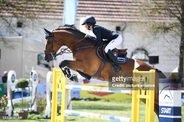 May 2021, Mecklenburg-Western Pomerania, Redefin: Riders Tour, Grand Prix, Jumping competition at the State Stud Redefin. Sophie Hinners from Germany...