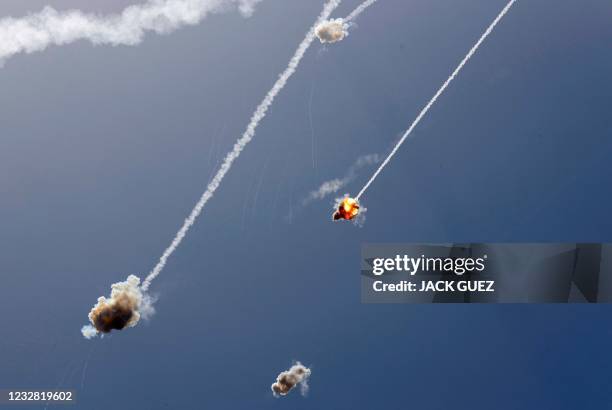 Israel's Iron Dome aerial defence system intercepts a rocket launched from the Gaza Strip, controlled by the Palestinian Hamas movement, above the...
