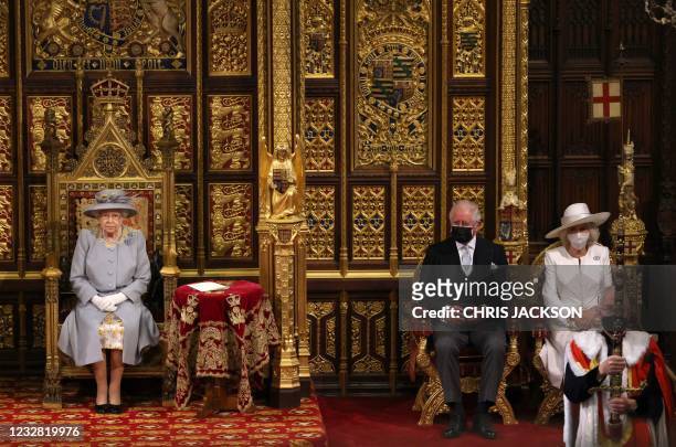 Britain's Queen Elizabeth II sits on the The Sovereign's Throne in the House of Lords chamber, with Britain's Prince Charles, Prince of Wales and...