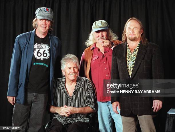 David Crosby points to an audience member while posing for a photo with once and future bandmates Stephen Stills , Graham Nash and Neil Young before...