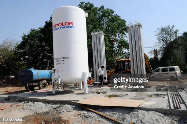 Engineers and labourers stalling oxygen cum storage plant at the Ramleela Maidan ground which is being temporarily converted into a Covid-19...