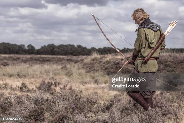 a individual viking archer warrior in the countryside - archery stock pictures, royalty-free photos & images