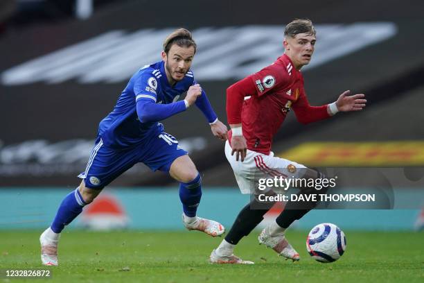 Leicester City's English midfielder James Maddison vies with Manchester United's English defender Brandon Williams during the English Premier League...