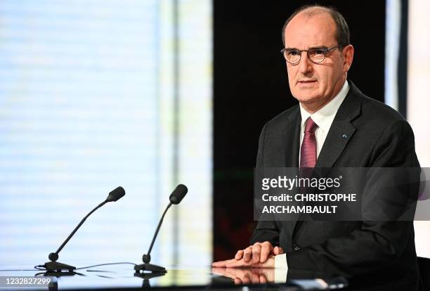 French Prime Minister Jean Castex looks on during the evening news broadcast of French TV channel France 2 in Paris on May 11, 2021.