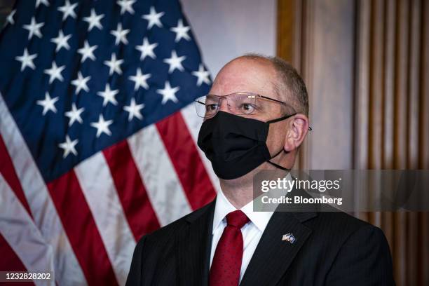 John Bel Edwards, governor of Louisiana, wears a protective mask as he participates in the mock swearing-in ceremony for Representative-elect Troy...