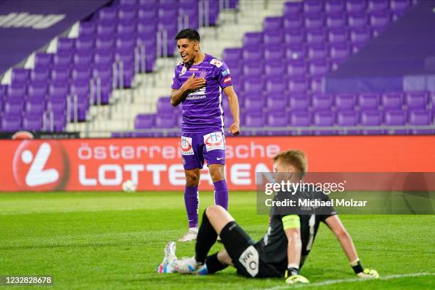 Manprit Sakaria of Austria Wien celebrates while Rene Swete of Hartberg reacts disappointed during the tipico Bundesliga match between FK Austria...