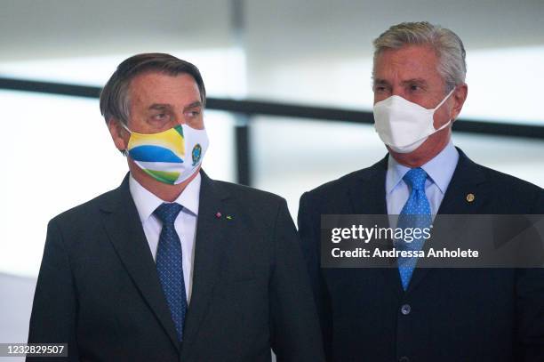 President of Brazil Jair Bolsonaro arrives with senator Fernando Collor de Mello during the announcement of a massive acquisition of intubation drugs...