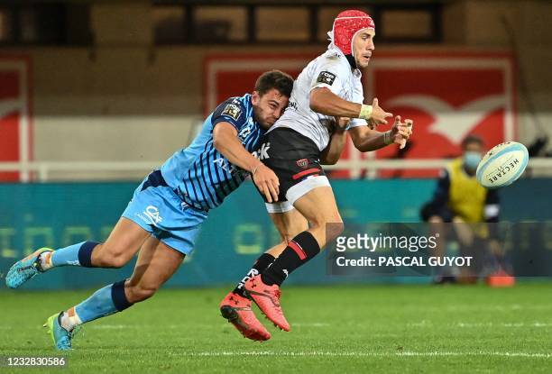 Montpellier's French centre Arthur Vincent challenges Toulon's French wing Gabin Villiere during the French Top14 rugby union match between...