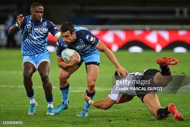 Montpellier's British centre Alex Lozowski is challenged during the French Top14 rugby union match between Montpellier Herault and RC Toulonnais at...