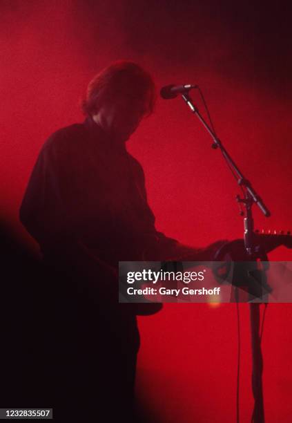 English Rock musician David Gilmour, of the group Pink Floyd, plays guitar as he performs onstage at Madison Square Garden, New York, New York,...