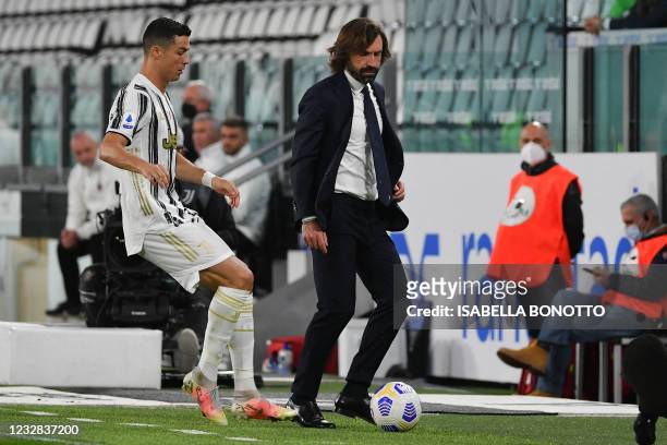 Juventus' Portuguese forward Cristiano Ronaldo goes for the ball next to Juventus' head coach Andrea Pirlo after the ball went out of play during the...