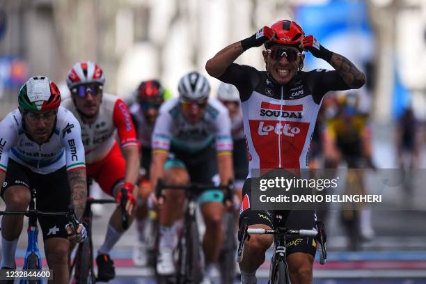 Team Lotto-Soudal rider Australia's Caleb Ewan celebrates after crossing the finish line ahead of Team Qhubeka Assos rider Italy's Giacomo Nizzolo...