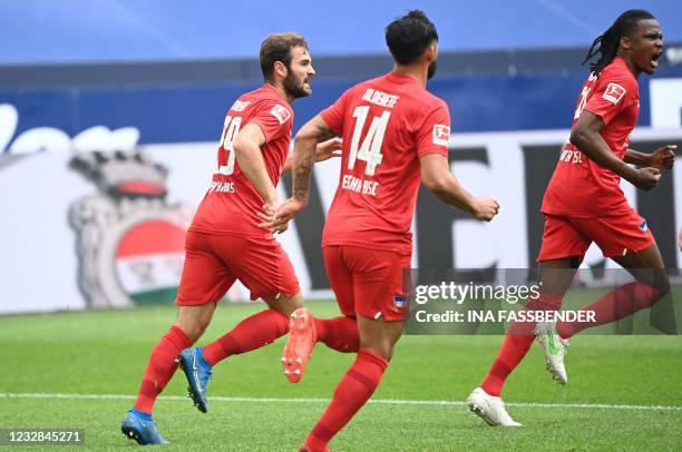 Hertha Berlin's Belgian defender Dedryck Boyata celebrates scoring the 1-1 during the German first division Bundesliga football match FC Schalke 04 v...