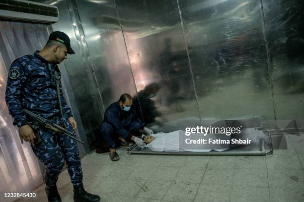 The body of the child Ali Nassar who was killed during an Israeli raid in central Gaza City on May 12, 2021 in Gaza City, Gaza. At least three dozen...