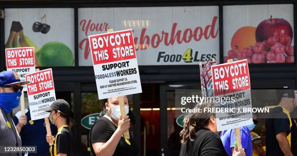 Grocery store workers represented by the United Food and Commercial Workers International Union hold a boycott rally in front of a Food4Less...