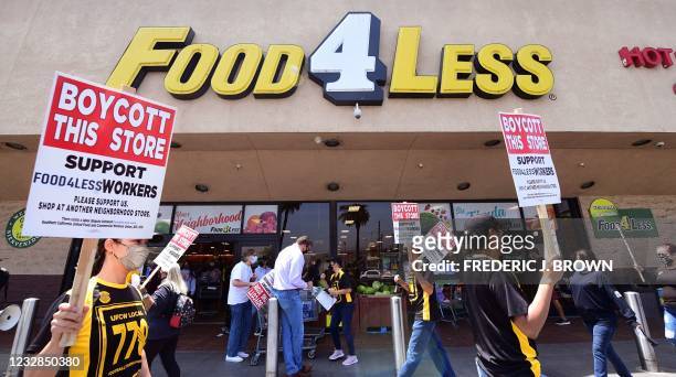 Grocery store workers represented by the United Food and Commercial Workers International Union hold a boycott rally in front of a Food4Less...