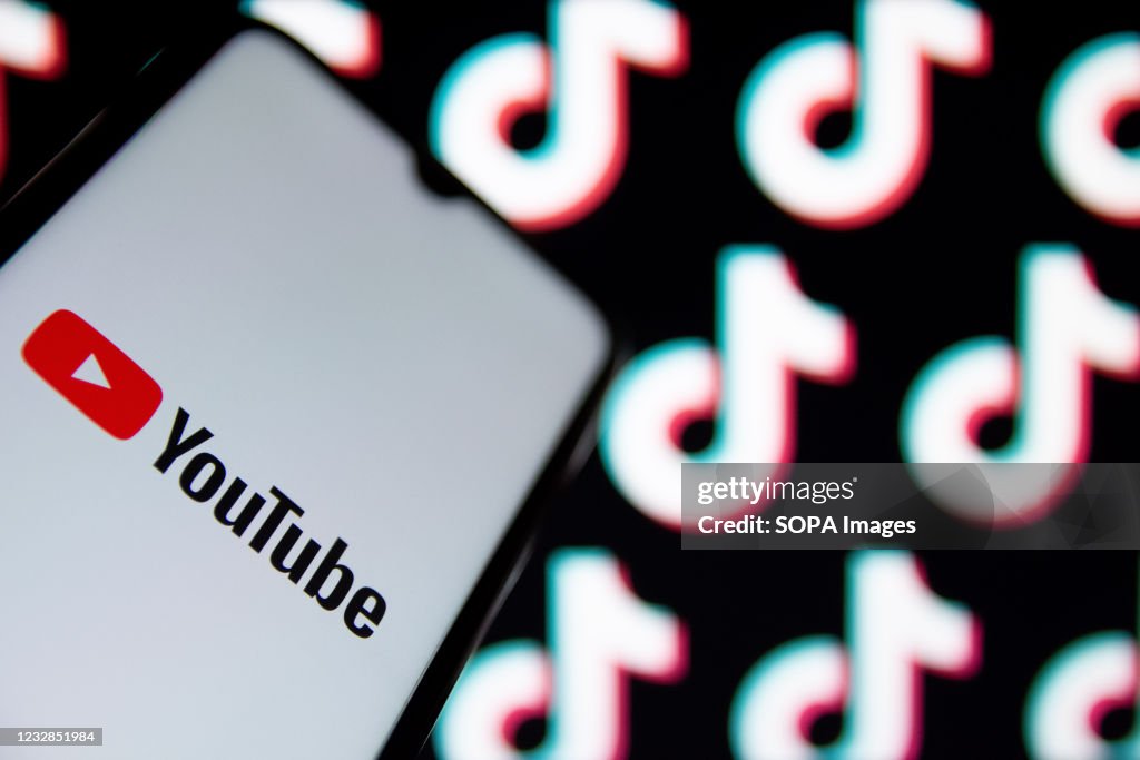 In this photo illustration a YouTube logo seen displayed on...