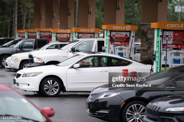 Motorists refuel at a Circle K gas station on May 12, 2021 in Fayetteville, North Carolina. Most stations in the area along I-95 are without fuel...