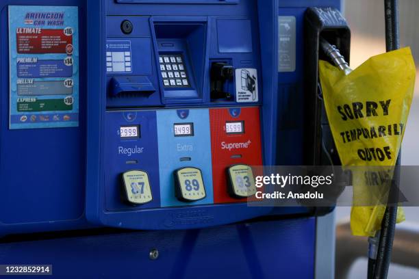 Sign reads "Temporarily Out of Service" is seen after ransomware cyberattack causes Colonial Pipeline to shut down, resulting in shortages in...