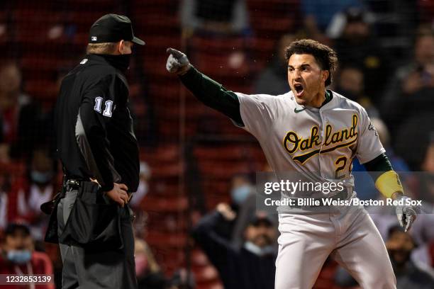 Ramon Laureano of the Oakland Athletics argues with home plate umpire Tony Randazzo as he is ejected from the game during the third inning of a game...